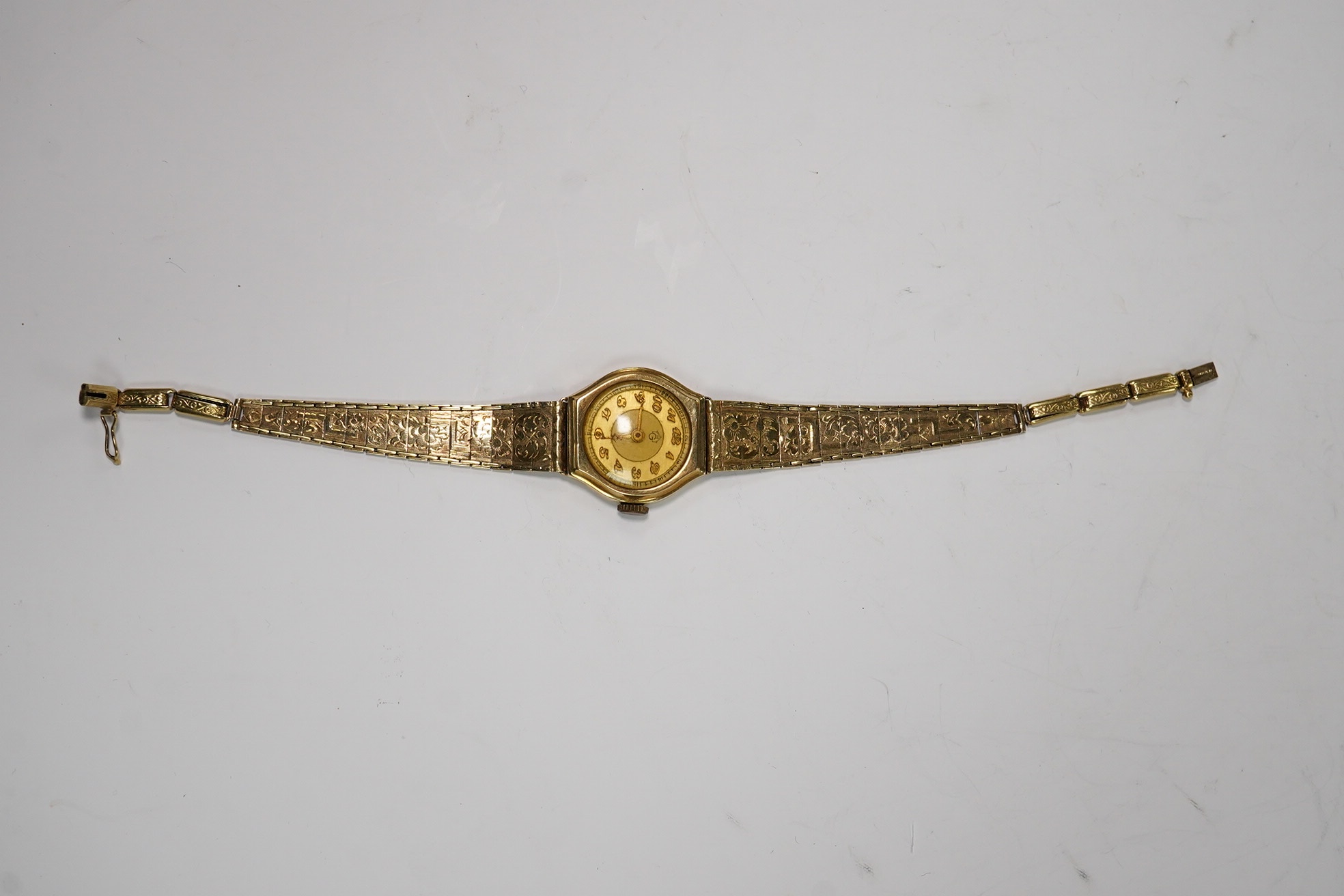 A lady's 14k manual wind wrist watch, on a 14k bracelet, gross weight 14 grams. Condition - poor to fair